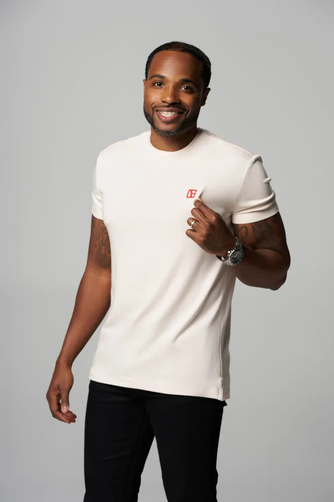 a man is wearing Cream-Red Label T-Shirt