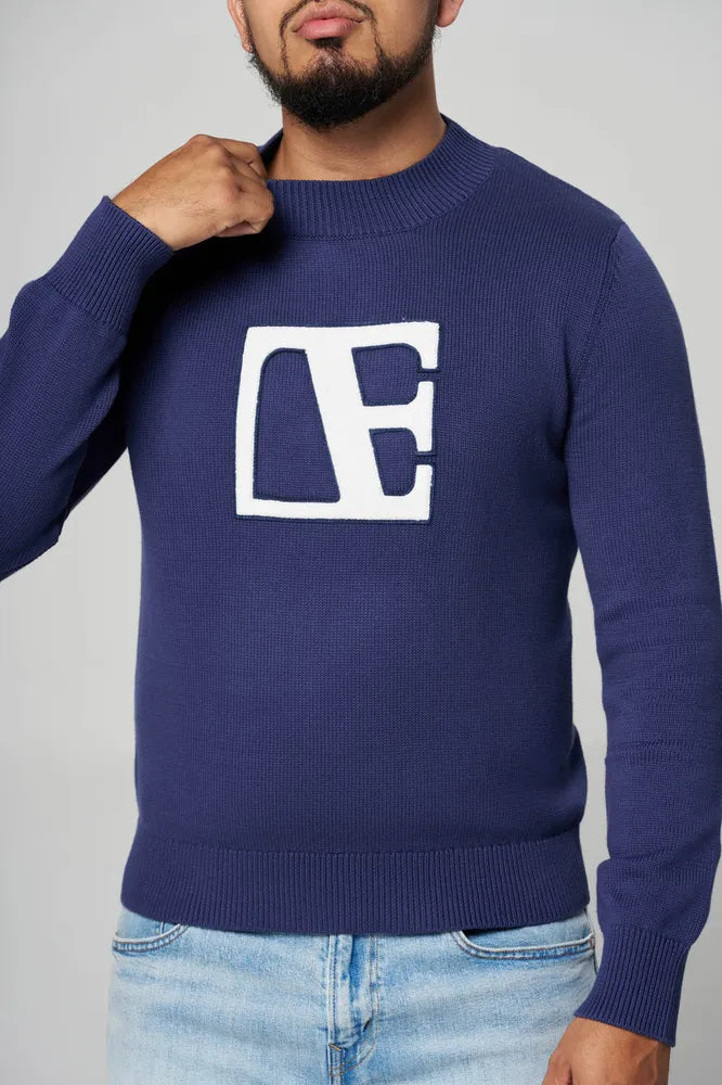 a man is wearing blue sweater