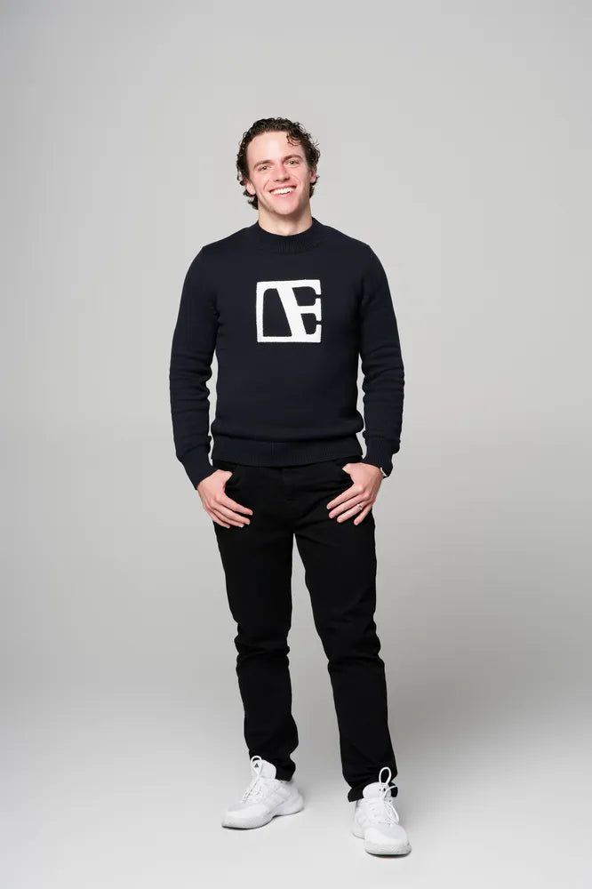 a man is wearing Navy Blue-Executive Label Sweater standing