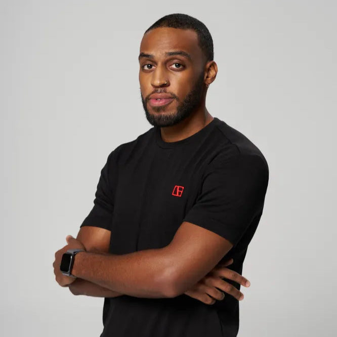a man is wearing black t shirt