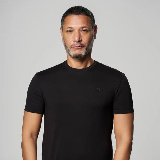 a man is wearing Black Executive Label T-Shirt