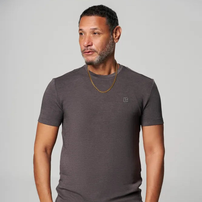 a man is wearing grey t shirt