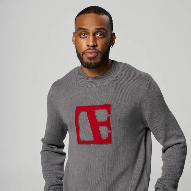 a man is wearing Gray-Red Label Sweater