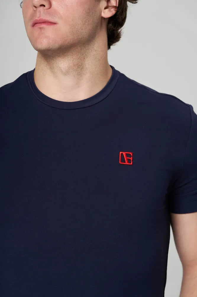 a man is wearing blue t-shirt 