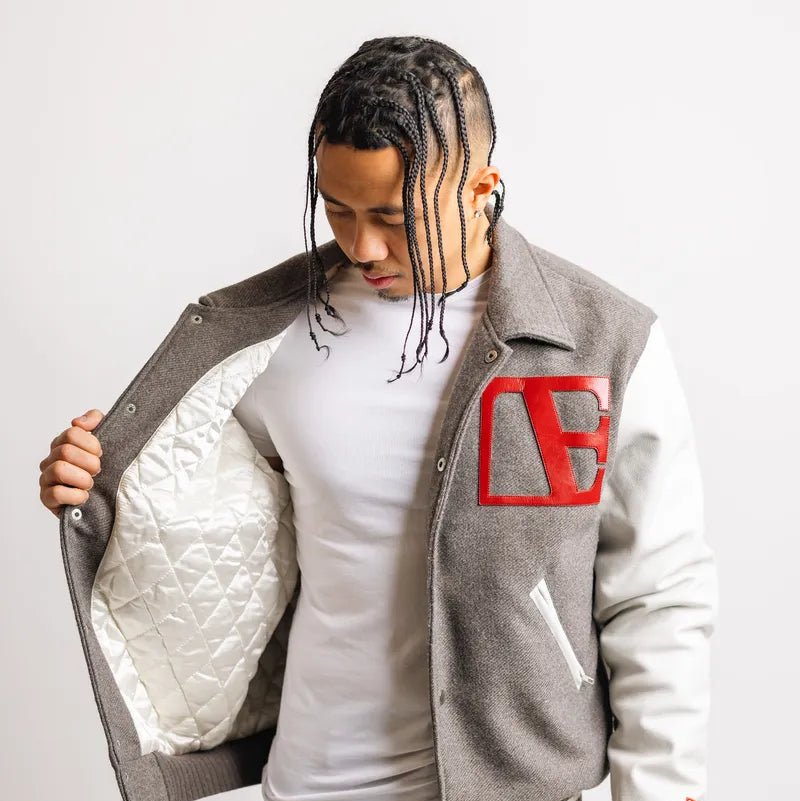 a man is wearing Gray-Red Label Letterman
