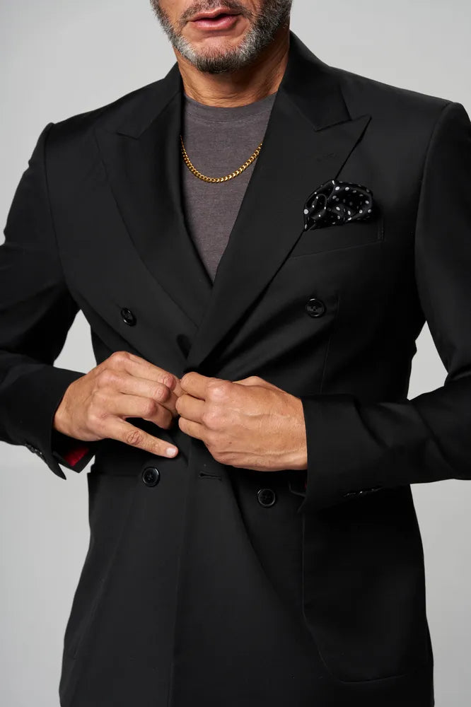 a man is wearing black coat inside grey t-shirt